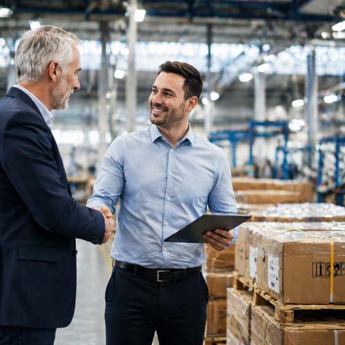 Business deal in an industrial warehouse